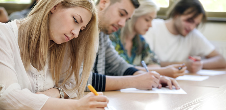 Students writing an exam in a classroom