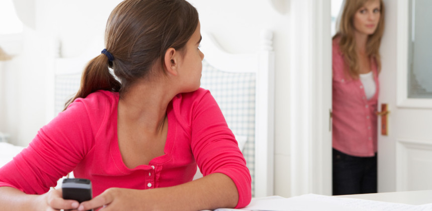 Girl not concentrating on her homework in her room