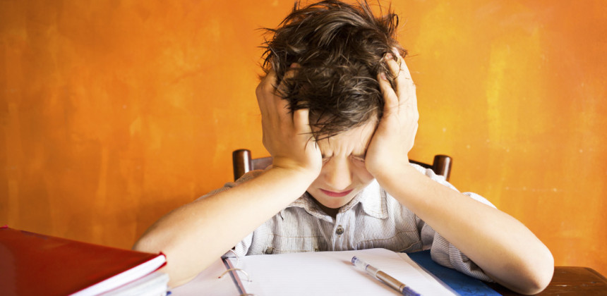 Boy trying to study in a noisy enviorment