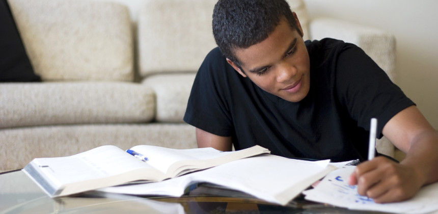 Young man studying in the living room
