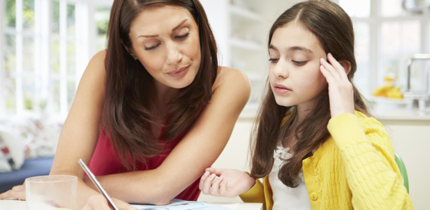 Little girl having trouble to concentrate while studying