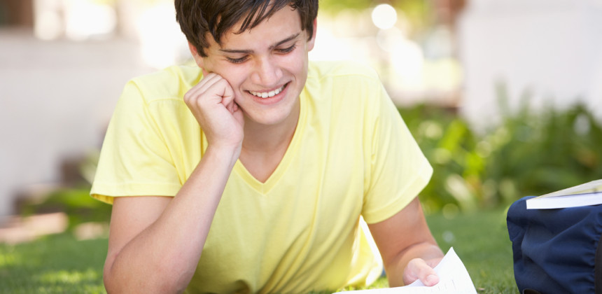 Young teen learning outside in the summer sun