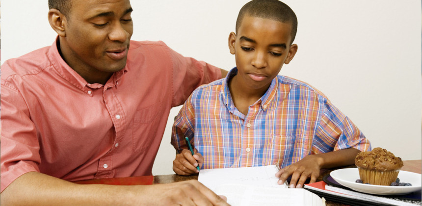 Student showing man his straight a report card