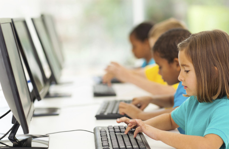children learning at school on computers