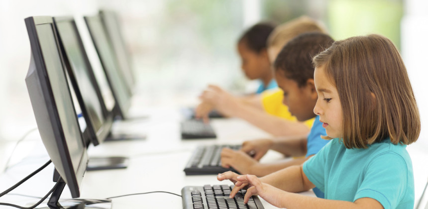 children learning at school on computers