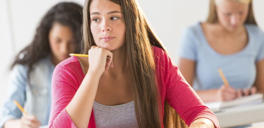 Student sitting in class thinking about math work
