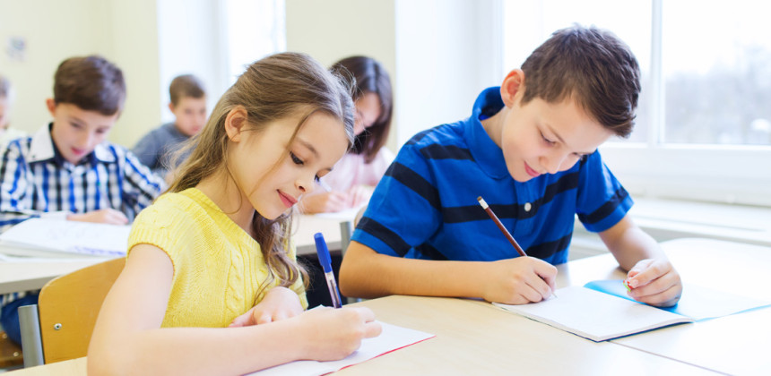 Students writing standardized tests in school