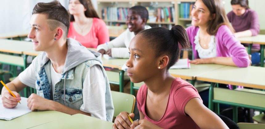 Students taking notes in class.