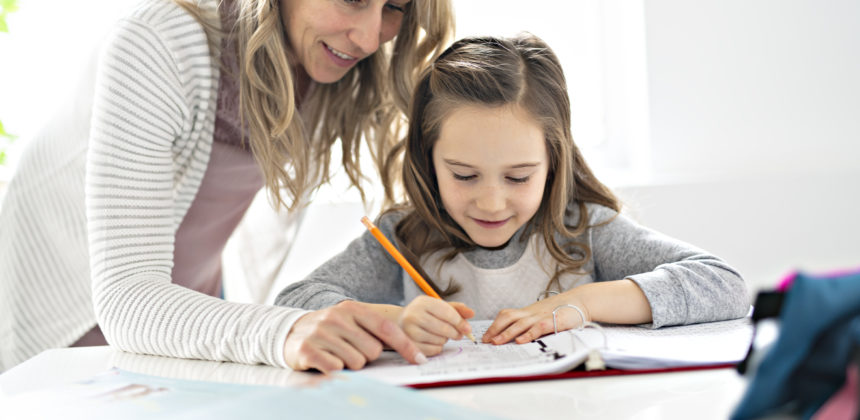 A Mother and Child doing homework at home