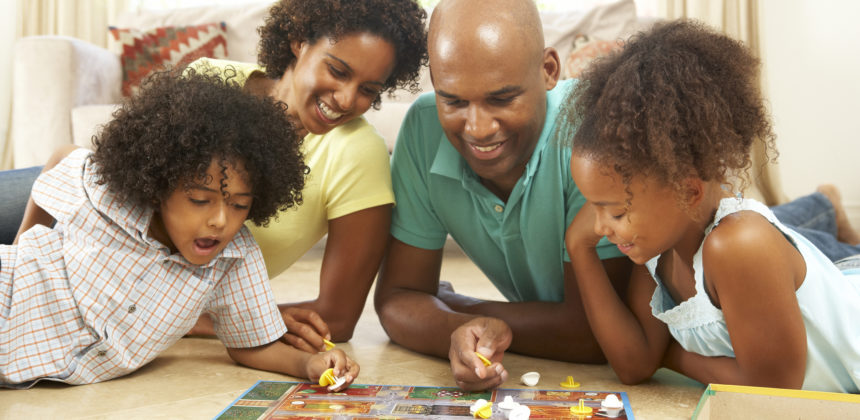 Family Plays Board Game