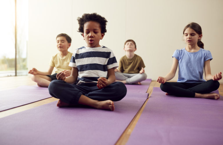 children participating in meditation practice
