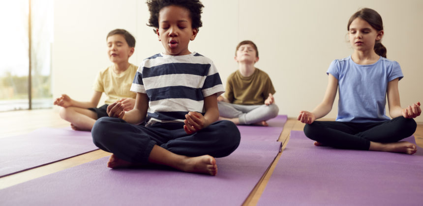 children participating in meditation practice
